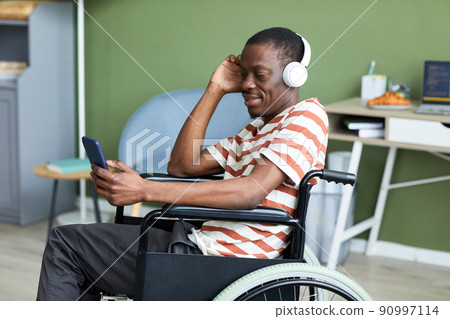 Man with Disability Listening to Music Side View 90997114