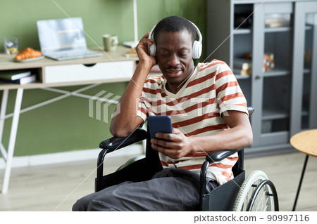 Man with Disability Listening to Music 90997116