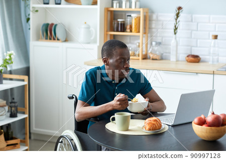 African American Man with Disability at Breakfast 90997128