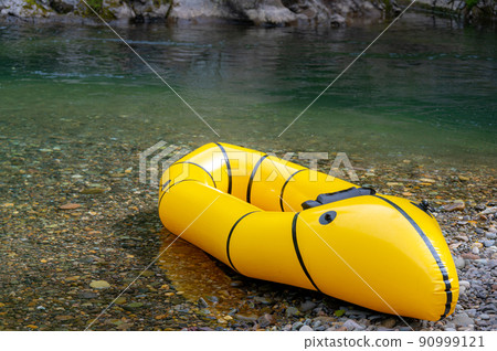 Packraft floating on the river 90999121