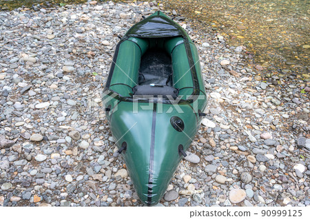 Packraft placed by the water 90999125