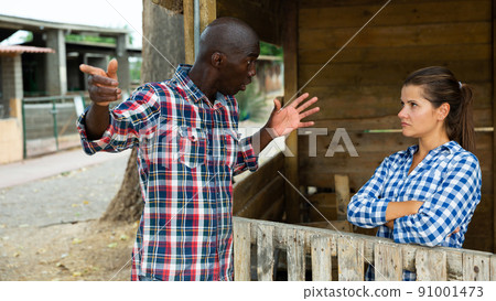 Angry woman quarreling with her afro-american male neighbor Angry woman quarreling with her afro-american male neighbor 91001473