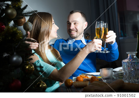 Happy couple celebrating Christmas Happy couple celebrating Christmas 91001502
