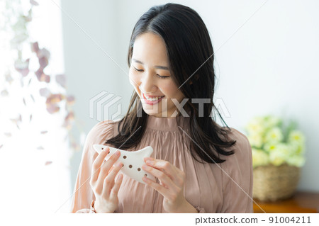 Woman with ocarina Woman with ocarina 91004211
