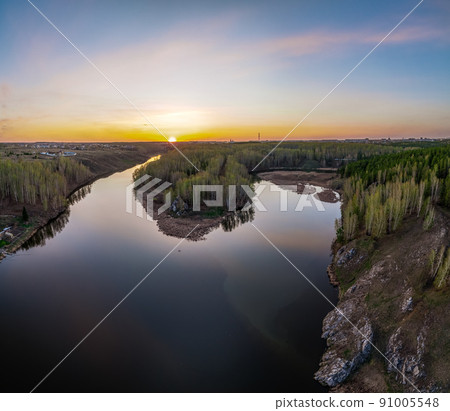 Confluence of the Iset and Kamenka rivers in the city Kamensk-Uralskiy. Iset and Kamenka rivers, Kamensk-Uralskiy, Sverdlovsk region, Ural mountains, Russia. Aerial view 91005548