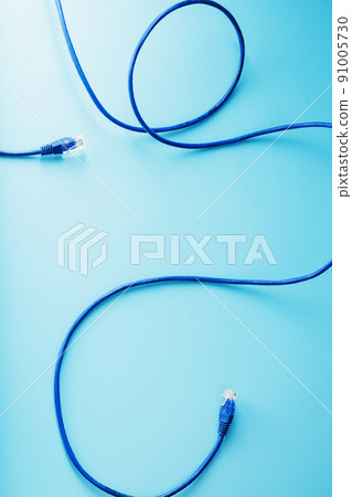 Blue UTP Internet Cable Isolated on a blue background Ethernet Cord 91005730