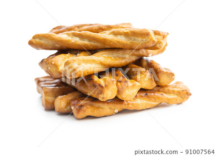 Salted pretzel sticks. Salted crackers isolated on white background. 91007564