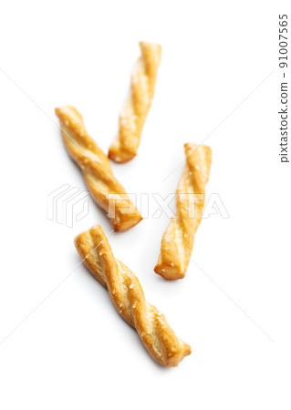 Salted pretzel sticks. Salted crackers isolated on white background. 91007565