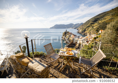 Served lunch table on the coast near Vernazza village in Italy 91008032