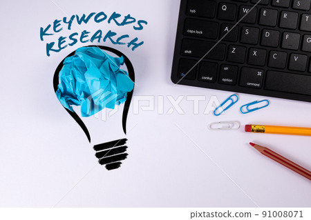 Keywords Research. Abstract light bulb and computer keyboard on a white background Keywords Research. Abstract light bulb and computer keyboard on a white background 91008071