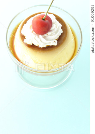A bird's-eye view of the old-fashioned retro pudding with cherries and cream on the sundae cup. A bird's-eye view of the old-fashioned retro pudding with cherries and cream on the sundae cup. 91009292