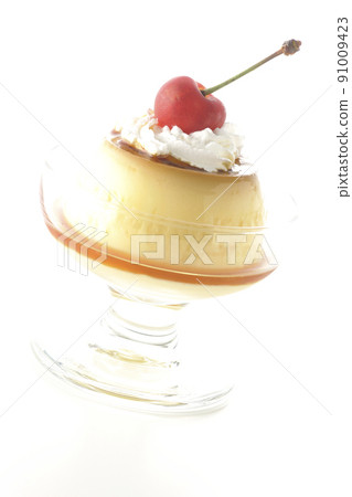 A traditional retro pudding with cherries and cream on a sundae cup taken on a white background 91009423