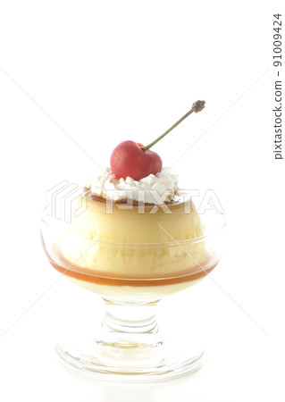 A traditional retro pudding with cherries and cream on a sundae cup taken on a white background 91009424
