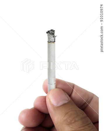 A cigarette in a hand, isolate hand and cigarette, cigarette white background A cigarette in a hand, isolate hand and cigarette, cigarette white background 91010974