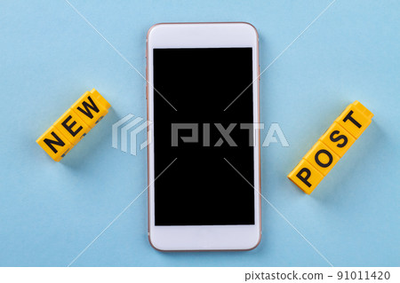 Flat lay new post concept on blue background. 91011420