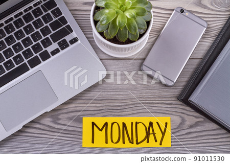 Top view electronic devices and flowerpot on wooden desk. Top view electronic devices and flowerpot on wooden desk. 91011530