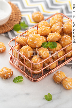 Delicious French Chouquette Choux Pastry dessert Pearl Sugar Puff on white marble background. 91011901