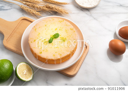 Delicious Lemon Glazed Pound Sponge cake on white marble table background. 91011906