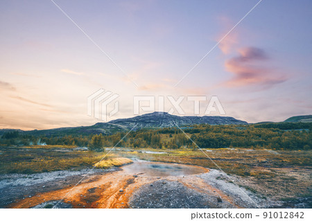 Steamy river with a geyser basin 91012842