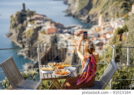 Woman traveling famous Cinque Terre towns in northwestern Italy Woman traveling famous Cinque Terre towns in northwestern Italy 91013164