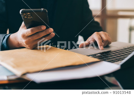 Hand using smartphone payments online shopping,  channel docking keyboard computer. 91013548