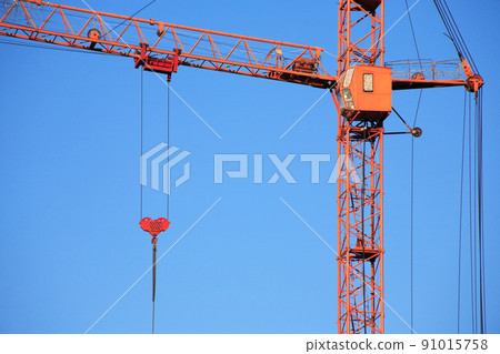 Construction Crane Against Blue Sky Construction Crane Against Blue Sky 91015758
