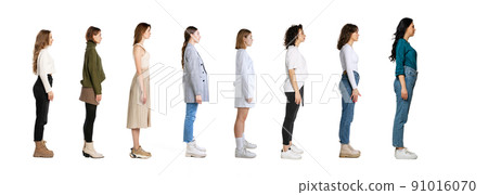 Profile view of young women standing in front of each other isolated over white background, Concept of youth, job, fashion Profile view of young women standing in front of each other isolated over white background, Concept of youth, job, fashion 91016070
