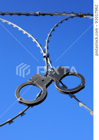 Old Handcuffs On Razor Wire 91017962