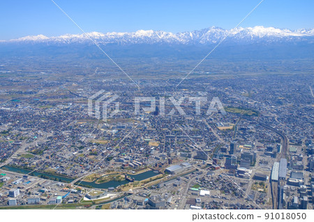 Aerial view, spring Tateyama mountain range and Toyama city 91018050