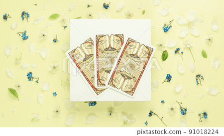 Blurred Summer esoteric concept , Fortune telling tarot predictions three cards flowers background 91018224