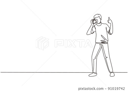 Single continuous line drawing photographer standing, thumbs up gesture, holding photo camera and photographing. Creative profession or occupation. One line draw graphic design vector illustration Single continuous line drawing photographer standing, thumbs up gesture, holding photo camera and photographing. Creative profession or occupation. One line draw graphic design vector illustration 91019742
