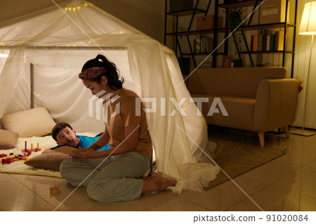 Worried Boy Looking at Reading Mother Worried Boy Looking at Reading Mother 91020084