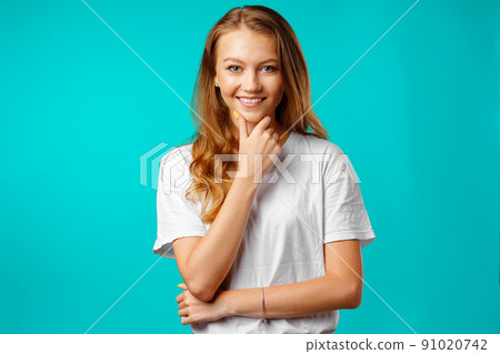 Portrait of a young beautiful happy woman smiling Portrait of a young beautiful happy woman smiling 91020742