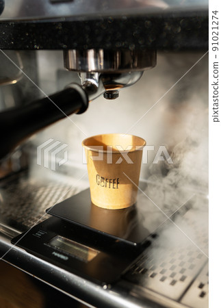 Disposable paper cup, coffee preparation, cooking process, hot steam. Barista work. The concept of cooking coffee, coffee to go. Disposable paper cup, coffee preparation, cooking process, hot steam. Barista work. The concept of cooking coffee, coffee to go. 91021274