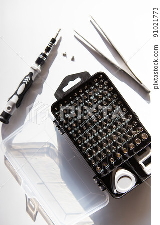 Set of screwdriver bits. Metal bits and adapters for screwdriver boxes. A set of tools for home use. 91021773