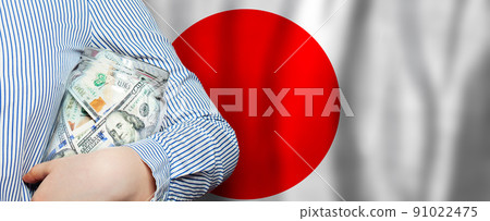 Us dollars on Japanese flag background Us dollars on Japanese flag background 91022475