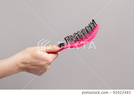 Pink hair comb and hair, hair loss concept 91022483