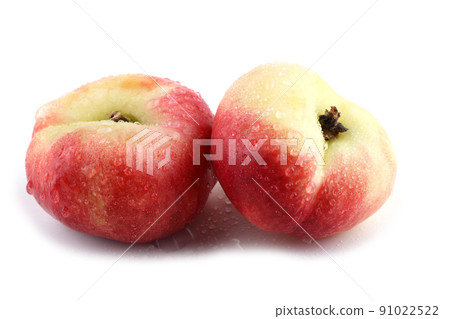 Flat peach (doughnut peach, donut peach, UFO peach, peento peach, saucer peach). Ancient Chinese variety "Pan tao". Delicacy Flat peach (doughnut peach, donut peach, UFO peach, peento peach, saucer peach). Ancient Chinese variety "Pan tao". Delicacy 91022522