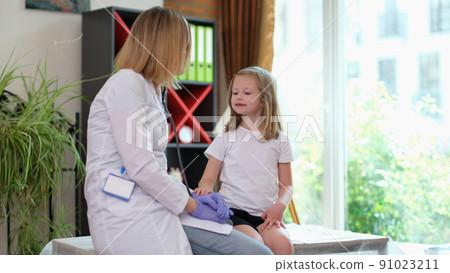 Cheerful little girl at doctor pediatrician appointment 91023211