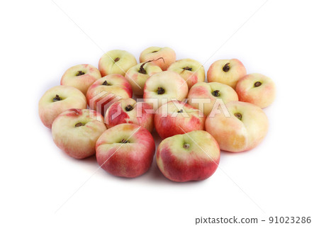 Flat peach (doughnut peach, donut peach, UFO peach, peento peach, saucer peach). Ancient Chinese variety "Pan tao". Delicacy Flat peach (doughnut peach, donut peach, UFO peach, peento peach, saucer peach). Ancient Chinese variety "Pan tao". Delicacy 91023286