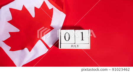 Canada Day, July 1 concept with Canadian flag on red Canada Day, July 1 concept with Canadian flag on red 91023462
