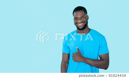 Thumbs up. Agreement sign. Offer advertising. Happy satisfied man showing like approval hand gesture on blue copy space banner background. Thumbs up. Agreement sign. Offer advertising. Happy satisfied man showing like approval hand gesture on blue copy space banner background. 91024434