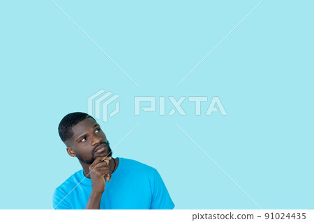 Curious man. Advertising banner. Special offer. Best deal. Interested thoughtful guy considering sale idea isolated on blue empty space background. Curious man. Advertising banner. Special offer. Best deal. Interested thoughtful guy considering sale idea isolated on blue empty space background. 91024435