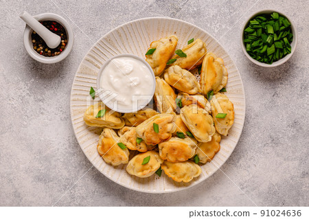 Dumplings, filled with mashed potatoes. 91024636