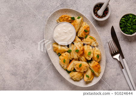 Dumplings, filled with mashed potatoes. 91024644