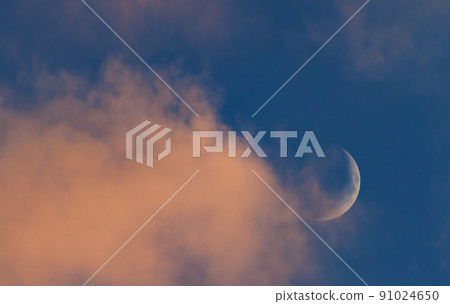 Sunset sky with large crescent moon, evening sky background 91024650