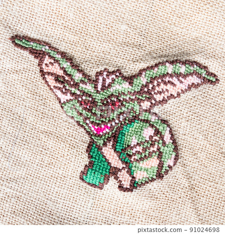 green gremlin embroidered by hand on fabric green gremlin embroidered by hand on fabric 91024698