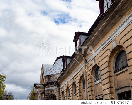 old abandoned building under gray clouds 91025017