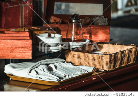 tea pot, cup and tea on a table tea pot, cup and tea on a table 91025143