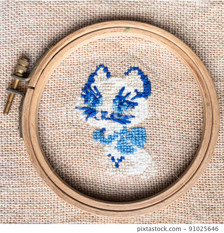 blue kitten in wooden hoop embroidered by hand 91025646